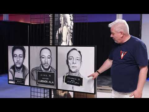 Glenn Beck presenting the 'What When Who' art print during a talk