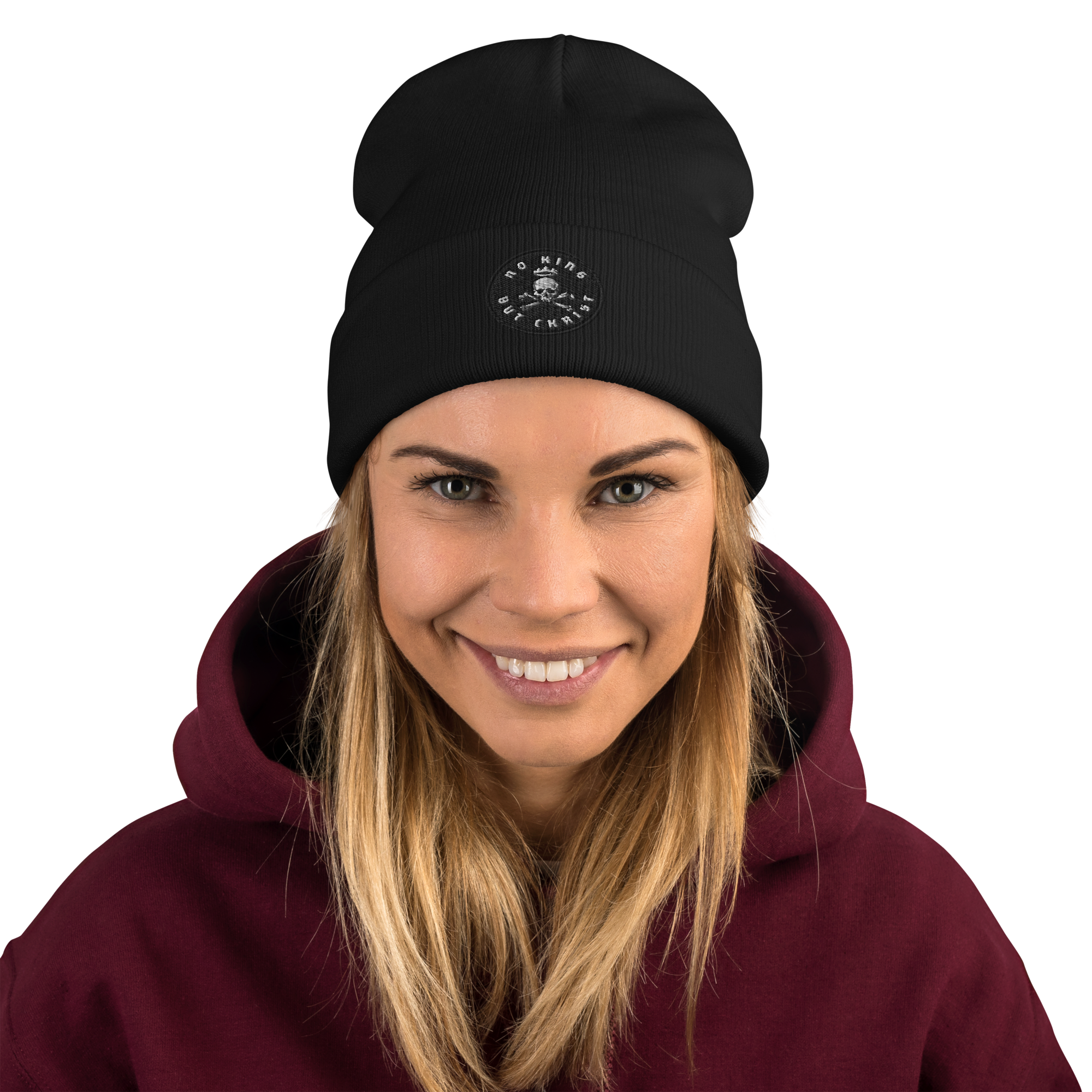 Woman wearing black embroidered beanie with No King But Christ seal, unisex knit hat, clean stitching and uncluttered design.