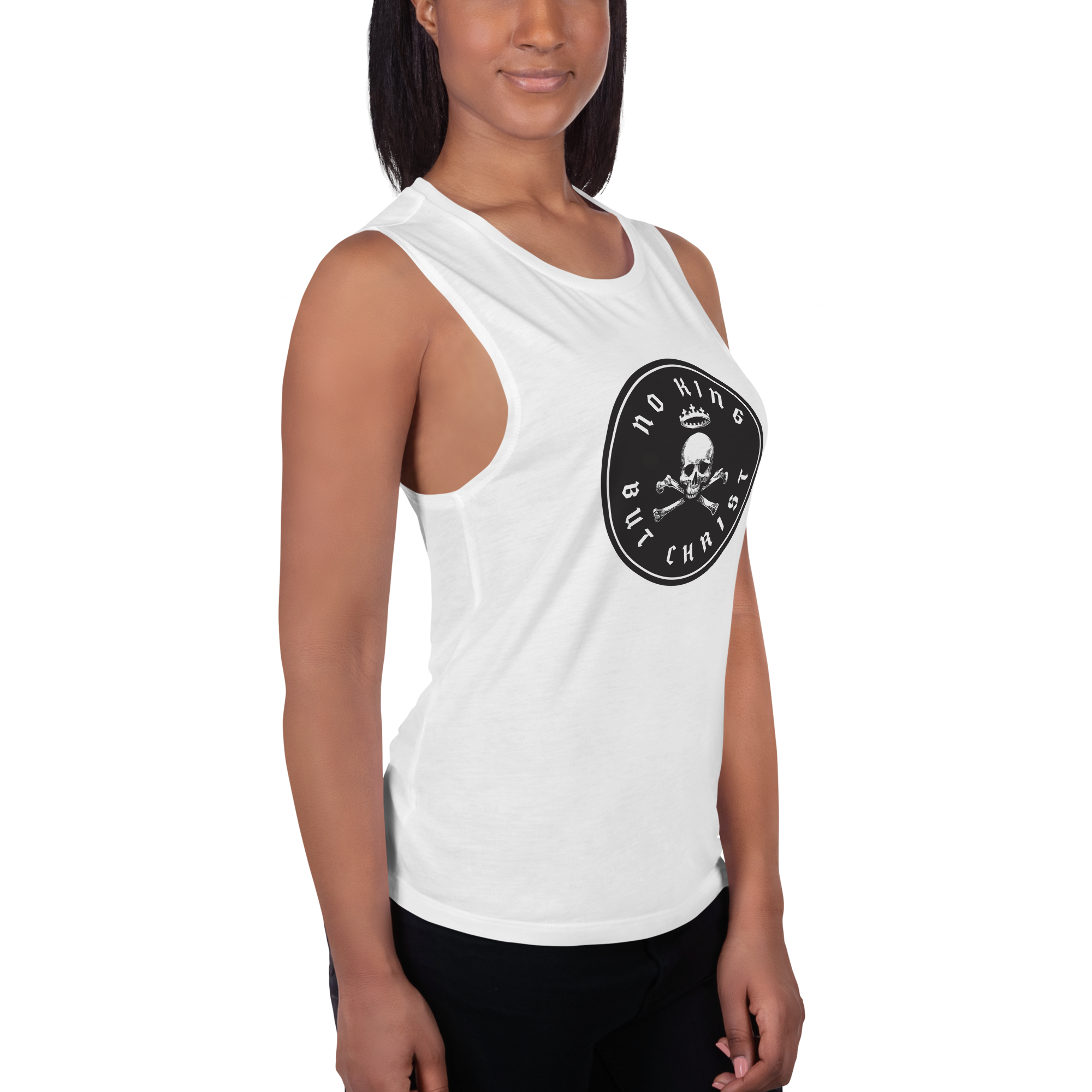 Woman angled right wearing white No King But Christ seal women's flowy muscle tank in side view featuring black crowned skull-and-crossbones emblem, faith-based apparel by Glenn Beck Shop