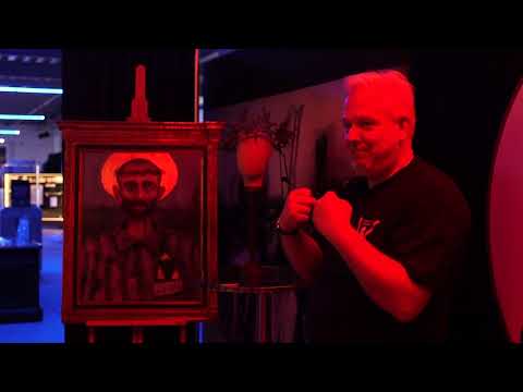 Detail from 'Holocaust Jesus' art print with red-toned scene of Christ comforting, by Glenn Beck